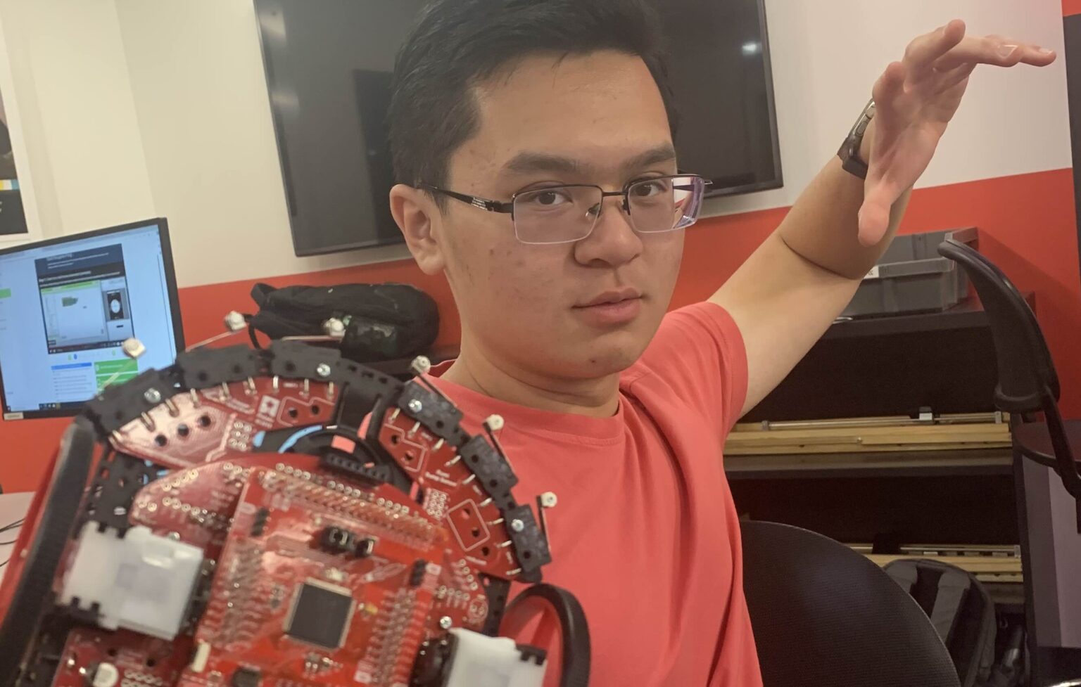 Me holding a Texas Instruments robot used in ENEE101